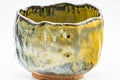 Japanese Matcha Bowl - Black and Yellow Undulating Wabi-Sabi Chawan - 450ml - closeup of the textured glaze and undulating lip
