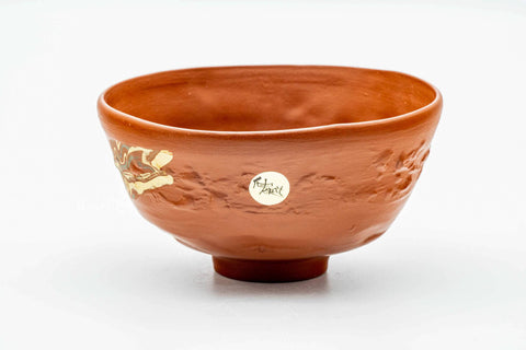 Tokoname nerikomi chawan, front view showing the gold-flecked marbled motif, with a small maker's sticker