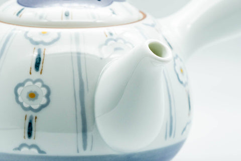 Close-up of the blue chrysanthemum-and-stripe decoration on the teapot body