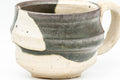 Tezumi — Japanese Teacup - Abstract Brown White Glazed Ushirode Yunomi - 200ml — tipped to show the interior