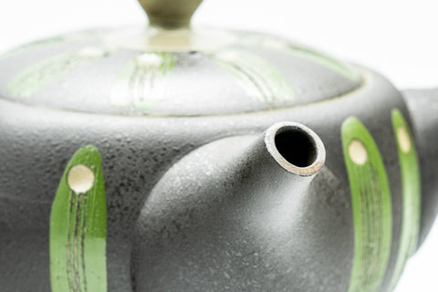 Close-up of the teapot's shoulder and lid detail.