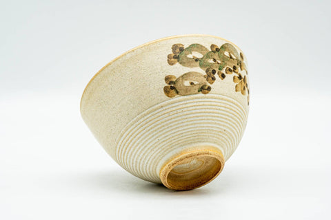 Japanese Teacup - Matte Beige Floral Kiyomizu-yaki Yunomi - 140ml - tilted view showing the foot and base with floral detail