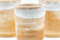 Close grouping of the three yunomi showing the crazed milky white glaze