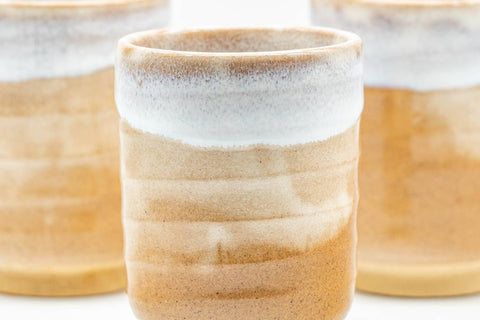 Close grouping of the three yunomi showing the crazed milky white glaze