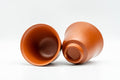 Japanese Teacup - Pair of Ume Red Shudei Tokoname-yaki Guinomi - 60ml - one cup upright and one tipped to show the interior