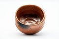 Overhead interior view of the bowl revealing the glazed inside with dark and orange tones.