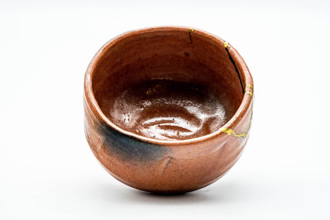 Overhead interior view of the bowl revealing the glazed inside with dark and orange tones.