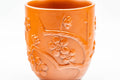 Tezumi — Japanese Teacup - Floral Sculpted Red Shudei Tokoname-yaki Yunomi - 125ml — tipped to show the interior