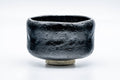 Opposite side showing the black glaze and cream foot