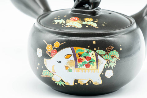 Japanese Kyusu - Year of the Pig Black Kurodei Tokoname-yaki Teapot - 360ml - closeup of the plum blossom decoration