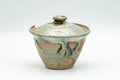 Japanese Tea Set - Hare's Fur Drip-Glazed Akogi-yaki Shiboridashi Teapot with 5 Guinomi Teacups - angled view of the lidded teapot