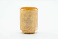 Teacup from another angle, showing the glaze wrapping around the body.
