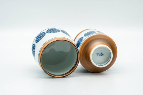 Tezumi — Japanese Teacups - Pair of Blue Orange Geometric Arita-yaki Meoto Yunomi — three-quarter view