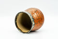 Japanese Teacup - Red Speckled Hare's Fur Glazed Yunomi - tilted to show the glazed interior and rim