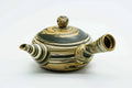 Angled view showing the side handle and spout.