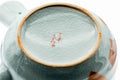 Japanese Kyusu - Red Bamboo Motif Kutani-yaki Porcelain Teapot - 370ml - closeup of the underside showing the porcelain foot and faint mark