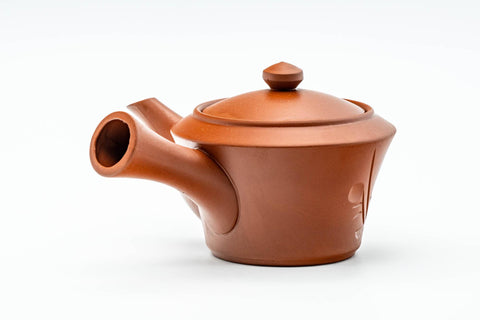 Three-quarter view of the teapot with the spout angled forward.