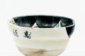 Three-quarter view showing the painted face and kanji.