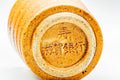 Close-up of the underside foot ring of the Shigaraki yunomi with an impressed maker's stamp