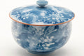 Tezumi — Japanese Teacup - Blue Floral White Porcelain Arita-yaki Lidded Yunomi - 140ml — tipped to show the interior