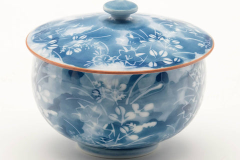 Tezumi — Japanese Teacup - Blue Floral White Porcelain Arita-yaki Lidded Yunomi - 140ml — tipped to show the interior