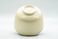 Inverted view of the chawan showing the beige unglazed foot and base