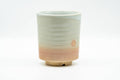 Beige, peach and white glazed Hagi-yaki yunomi teacup - front view
