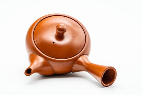 Overhead view of the teapot showing the fitted lid, knob and side handle.