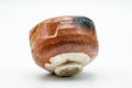Bowl tilted to show the unglazed foot and pale base.