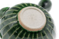 Green faceted Oribe Tokoname teapot, underside view showing the pale foot and stamp