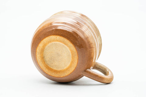 Three-quarter view of the underside, showing the foot ring and base.