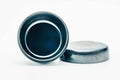 Black-lacquer floral matcha tea caddy, overhead view with lid off, dark interior cavity with the lid lying beside