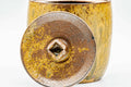 Underside and base view showing the unglazed foot and the lid's knob.