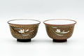 Pair of Tokoname-yaki yunomi teacups, front view, with textured brown exteriors decorated with white flowers and white inner glaze