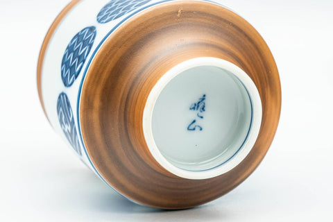 Tezumi — Japanese Teacups - Pair of Blue Orange Geometric Arita-yaki Meoto Yunomi — tipped to show the interior