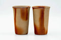 The two matching Bizen-yaki cups standing side by side, front view.