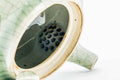 Interior view of the green celadon Obori Soma kyusu showing the perforated strainer holes, with the lid removed