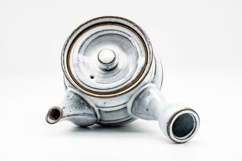 Overhead view looking down on the lid knob, spout and side handle.