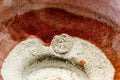 Macro close-up of the foot and base with maker's mark and gold repair detail.