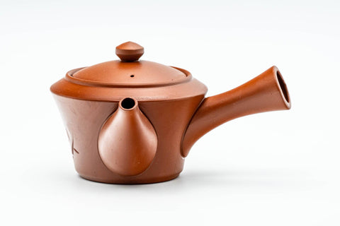 Rear three-quarter view of the teapot showing the handle, spout and lid knob.