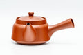 Teapot in three-quarter view from above, showing the side handle and engraved bamboo decoration