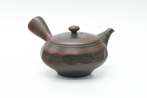 Rear three-quarter view showing the side handle of the teapot.