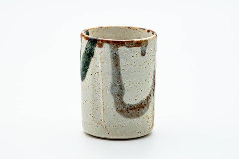 The cup from another angle, showing the abstract brushwork.