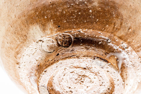 Close-up of the inverted biwa-iro Hagi chawan base, showing the spiral-trimmed foot ring