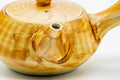 Close-up of the spout and striped yellow-brown glaze.