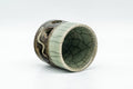 Tezumi — Japanese Teacup - Small Celadon Glazed Obori Soma-yaki Guinomi - 25ml — three-quarter view