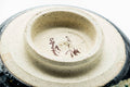 Closeup of the foot and exposed clay base of the black metallic chawan