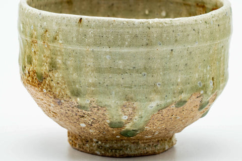Side view of the Shigaraki chawan showing the green celadon glaze and earthy body