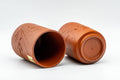 Japanese Teacups - Pair of Bamboo Engraved Tokoname-yaki Meoto Yunomi - both cups lying on their sides showing the interiors