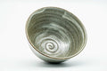 Overhead view into the bowl, showing the spiral pattern in the glazed interior well.